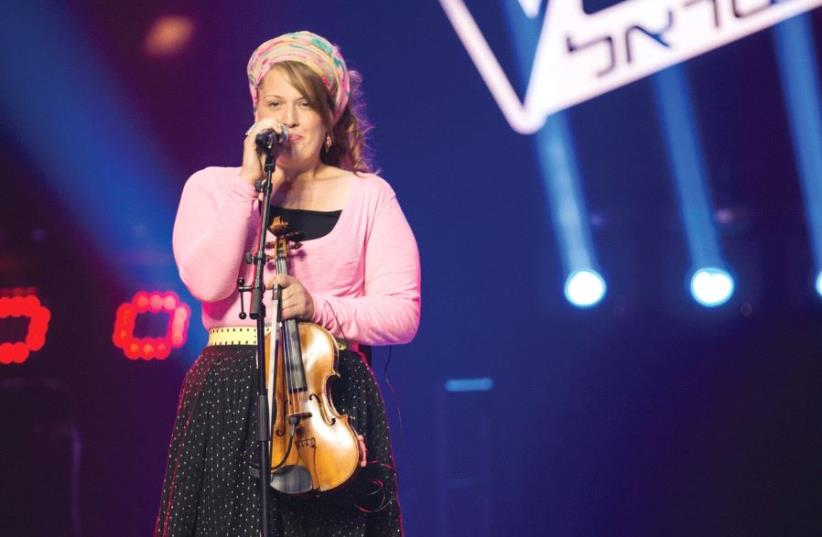 ‘I’M CONSTANTLY exploring ways that I can connect more with my audience and bring what it that I want to bring when I perform,’ says violinist Ariella Zeitlin-Hoffman seen here on ‘The Voice Israel.’ (photo credit: MICHAEL LOUBOTIN)