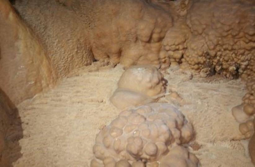 Rare stalactite, stalagmite cave discovered near Galilee (photo credit: SHAI KOREN/NPA)