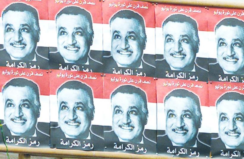 A BILLBOARD with images of former Egyptian president Gamal Abdel Nasser, who pressured Morocco to prevent immigration to Israel. (photo credit: REUTERS)