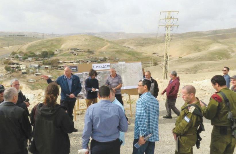 THE KNESSET’S Foreign Affairs and Defense Committee subgroup on Judea and Samaria observes Palestinian villages along Route 1 yesterday, near Ma’aleh Adumim (photo credit: MK MOTI YOGEV’S OFFICE)