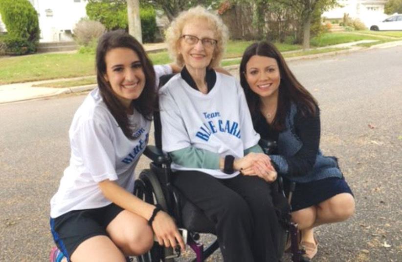 SARAH MIZRACHI (left) ran in the New York Marathon in November to raise money for The Blue Card and help people like Auschwitz survivor Irene Hizme. They are pictured with Masha Pearl, the NGO’s executive director. (photo credit: THE BLUE CARD)