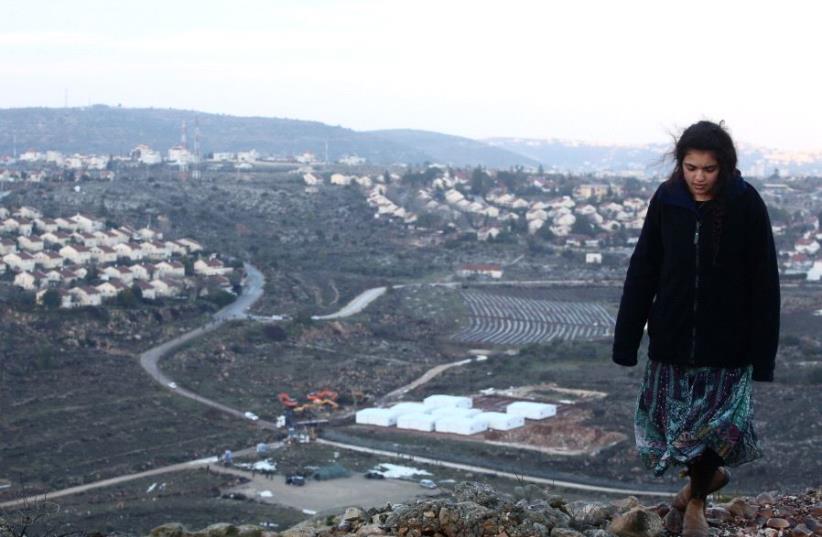 Amona resident with Ofra background (photo credit: MARC ISRAEL SELLEM)
