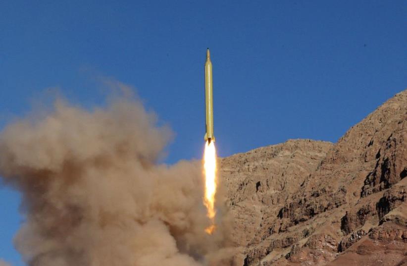 A ballistic missile is launched and tested in an undisclosed location, Iran, March 9, 2016.  (photo credit: REUTERS)