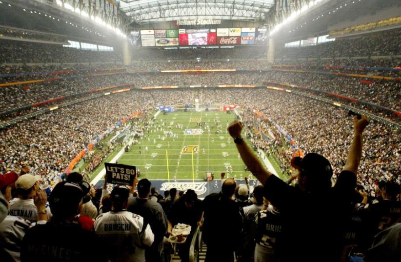 The field at Reliant Stadium is seen from overhead just before the start of Super Bowl XXXVIII, in Houston, Texas (photo credit: REUTERS)