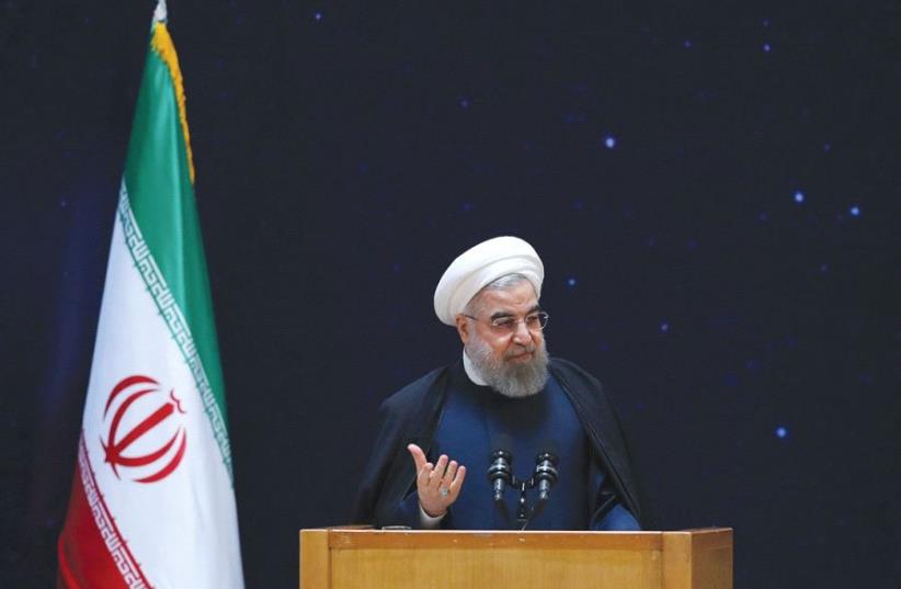 IRANIAN PRESIDENT Hassan Rouhani speaks in Tehran. (photo credit: REUTERS)