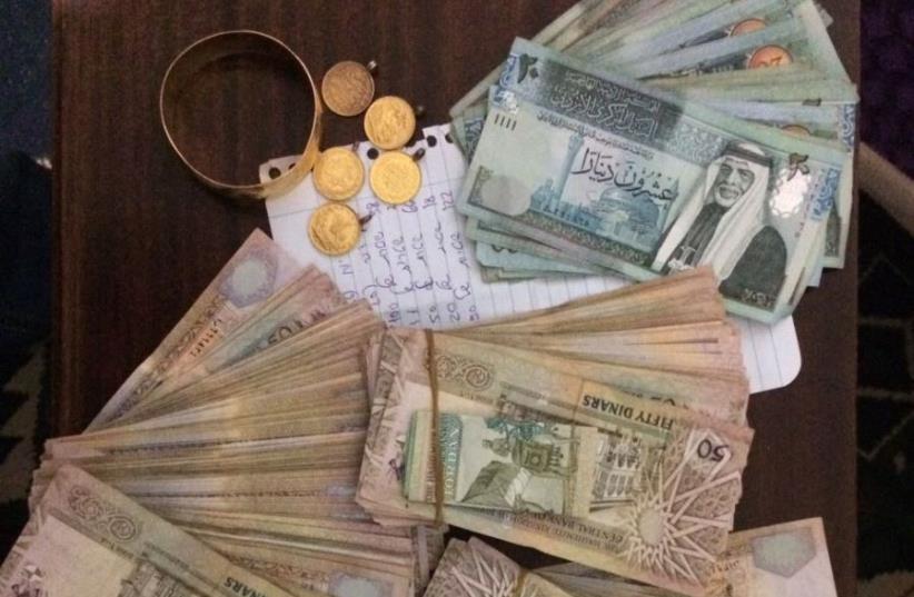 Funds seized by security forces. (photo credit: POLICE SPOKESPERSON'S UNIT)