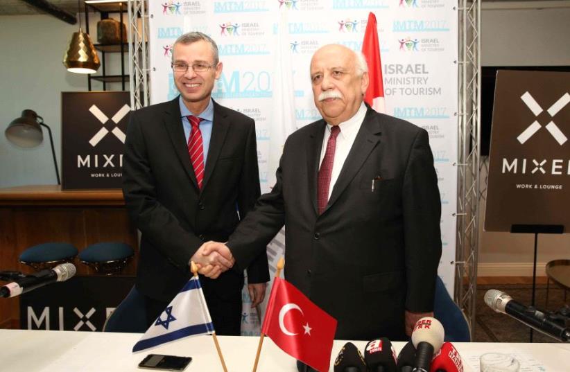 Yariv Levin and Turkish Culture and Tourism Minister Nabi Avci meet at the the opening of the International Mediterranean Tourism Market on February 7, 2017 (photo credit: CHEN GALILI)