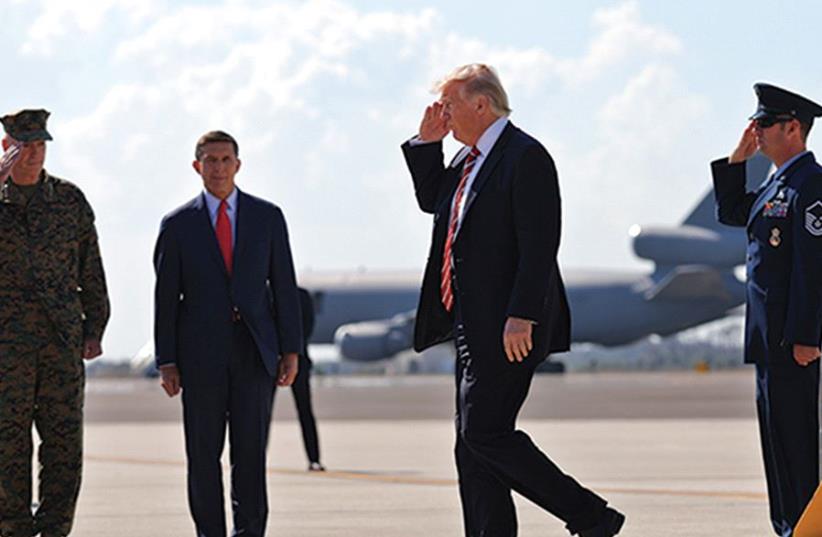 US PRESIDENT Donald Trump salutes as he arrives at MacDill Air Force Base in Tampa, Florida, on Monday (photo credit: REUTERS)