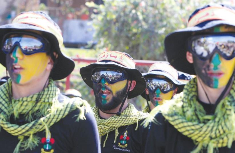 HEZBOLLAH MEMBERS march during a religious procession in Nabatiyeh in southern Lebanon last October (photo credit: REUTERS)