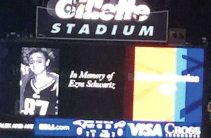 EZRA SCHWARTZ being honored with a moment of silence at a New England Patriots game in 2015. (photo credit: Courtesy)