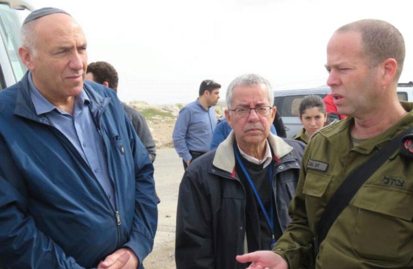 MK MOTI YOGEV listens to a colonel during a tour of Judea and Samaria last month. (photo credit: Courtesy)