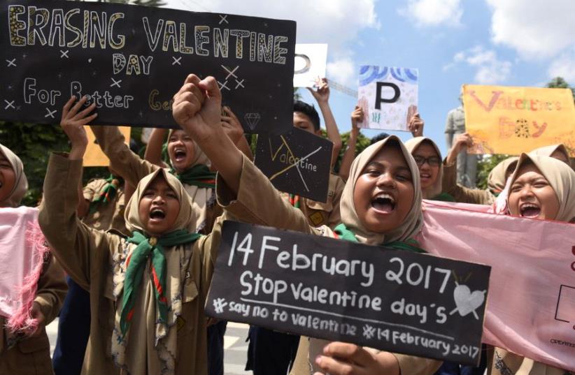Muslim students shout slogans during a protest against Valentine's Day celebrations in Surabaya, Indonesia, February 13, 2017 (photo credit: REUTERS)