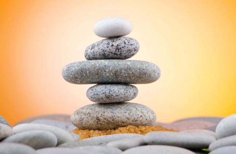 Balanced pebbles (photo credit: INGIMAGE)