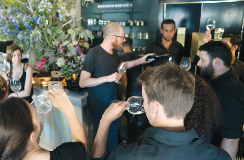 Elad Shoham – wine enthusiast, sommelier and beverage director – on the move, giving pre-service training (photo credit: Courtesy)