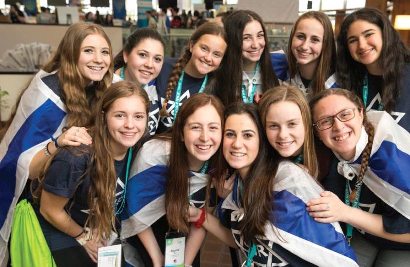 Teenage girls smile while attending the BBYO international convention in Dallas. (photo credit: JASON DIXSON)