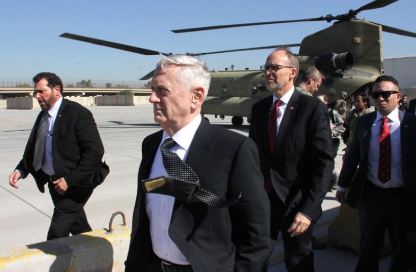 The new Pentagon chief and US Secretary of Defence, James Mattis (C), arrives in the Iraqi capital Baghdad, on February 20, 2017 (photo credit: THOMAS WATKINS / AFP)