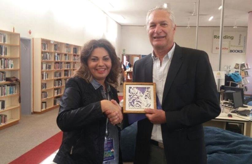 Snunit CEO Revital Rubin in January with Geoff Cohen, the principal of the Herzliya School in Cape Town, South Africa (photo credit: Courtesy)