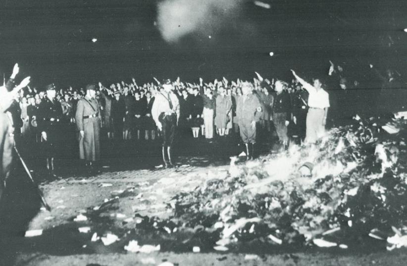The Nazis stage a book burning at a public square in Berlin in 1933 (photo credit: Wikimedia Commons)