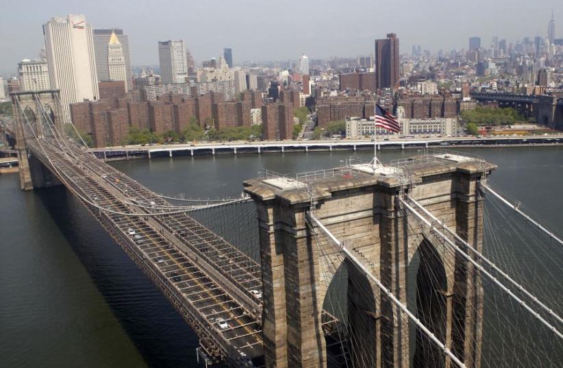 The Brooklyn Bridge and lower Manhattan is seen from a helicopter in New York City, April 22, 2010.  (photo credit: REUTERS)