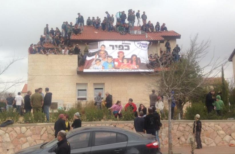 Ofra Youth gather on roof of home slated for demolition (photo credit: JEREMY SHARON)
