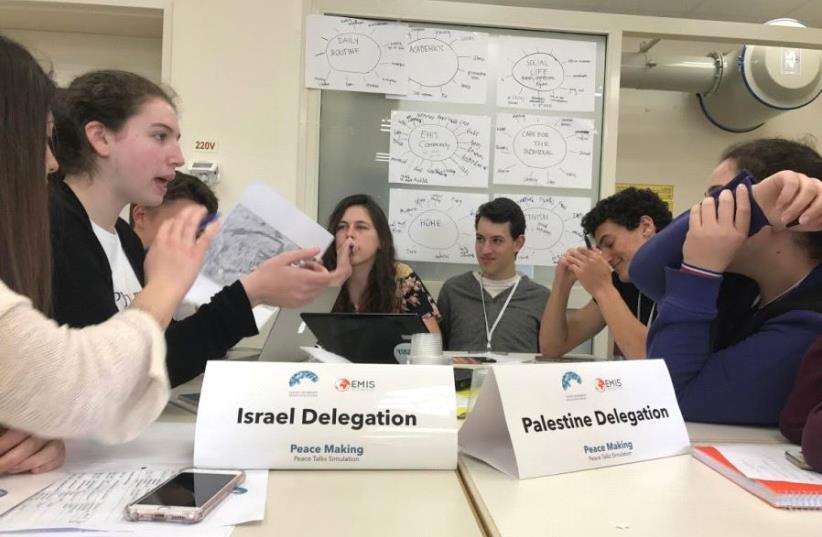 Students broke up into Israeli and Palestinian delegations and negotiated peace deals at the Charney Resolution Center in Kfar Hayarok (photo credit: ELIYAHU KAMISHER)