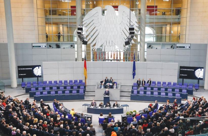 GERMAN PRESIDENT-ELECT Frank-Walter Steinmeier gives a speech after the first round of voting in the German presidential election at the Reichstag in Berlin last month. But are dark, undemocratic clouds gathering? (photo credit: REUTERS)