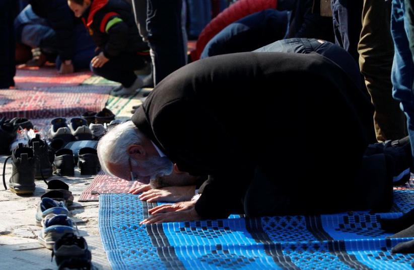 Muslims pray during Friday prayers on the street near the Murat Pasha Mosque in the old town of Skopje, Macedoni (photo credit: REUTERS)