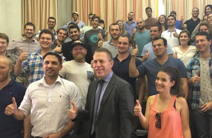A GROUP of IDF reservists pose yesterday with Public Security and Strategic Affairs Minister Gilad Erdan (center) at a two-day seminar teaching how to combat BDS. (photo credit: LIDAR GRAVÉ-LAZI)