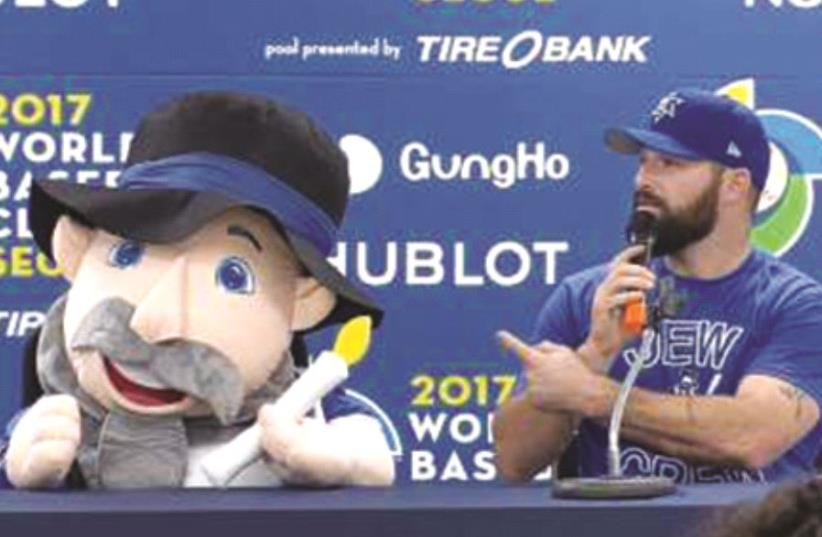 World Baseball Classic: Team Israel’s Cody Decker and team mascot, “the Mensch on the Bench” (photo credit: MLB/COURTESY)