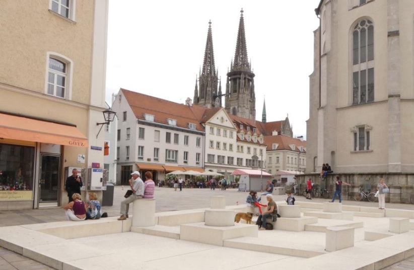 The modern memorial built over the remains of the 1519 destroyed synagogue in Regensburg’s Neupfarrplatz. The spires of the cathedral are seen in the background (photo credit: IRVING SPITZ)