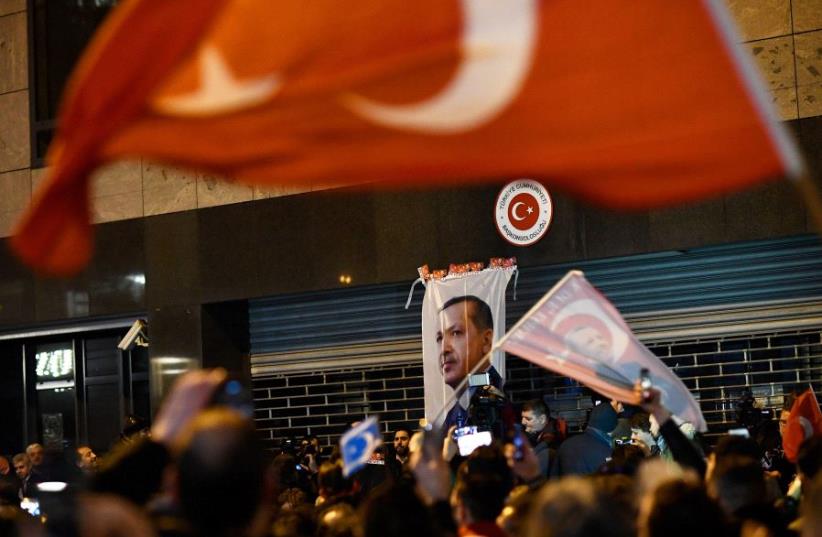Demonstrators gather ahead of clashes with riot police outside the Turkish consulate in Rotterdam, Netherlands (photo credit: REUTERS)