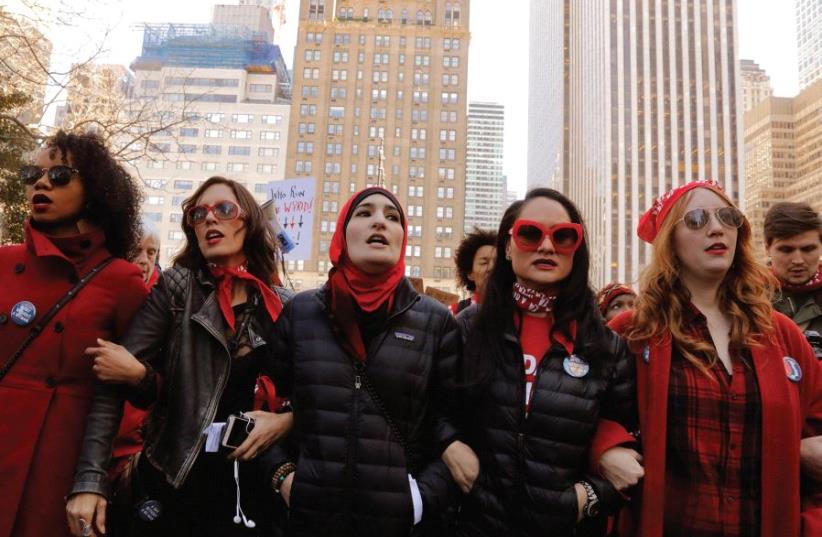 ORGANIZERS LINDA SARSOUR (center), Carmen Perez and Bob Bland lead during a ‘Day Without a Woman’ march on International Women’s Day in New York, on March 8th. (photo credit: REUTERS)