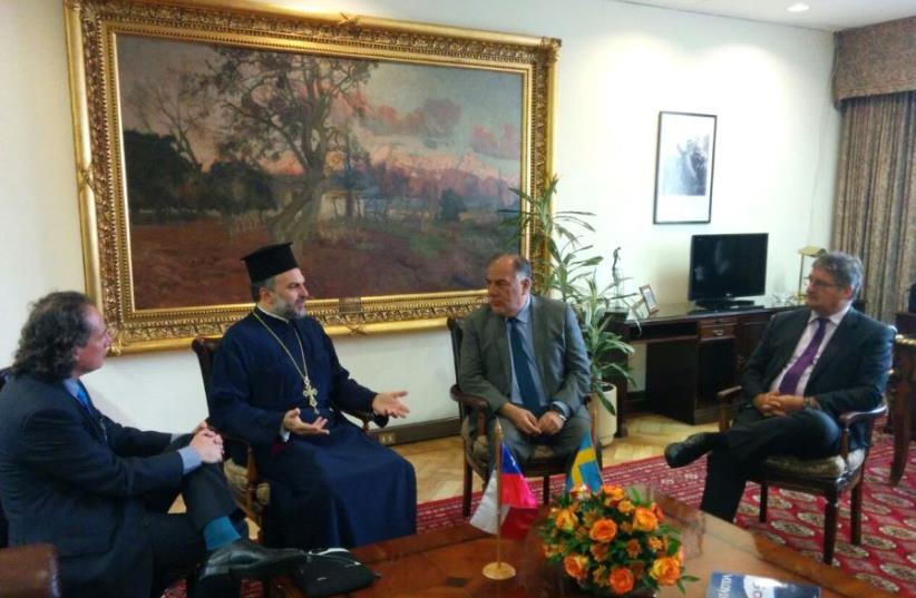 Father Naddaf meets last week with Osvaldo Andrade (second right), the head of the Chamber of Deputies, Chile's lower house of Congress (photo credit: JNF-KKL CHILE)