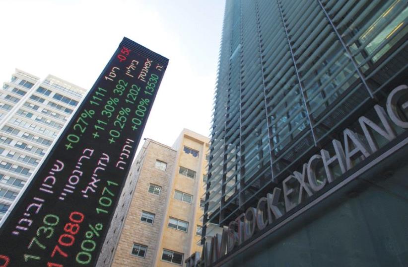 An electronic board displaying market data is seen at the entrance to the Tel Aviv Stock Exchange (photo credit: REUTERS)