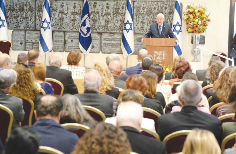 PRESIDENT REUVEN RIVLIN addresses the 13th Council for Higher Education appointment ceremony at the President’s Residence yesterday. (photo credit: MARK NEYMAN / GPO)
