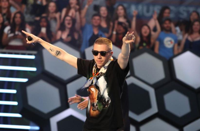 Macklemore performs during the iHeartRadio Much Music Video Awards (MMVAs) in Toronto, Ontario, Canada June 19, 2016.  (photo credit: REUTERS)
