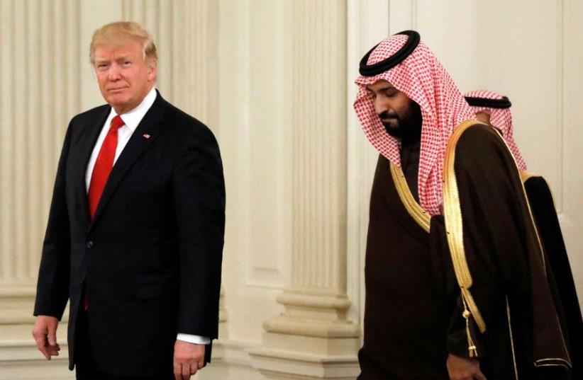 US President Donald Trump and Saudi Deputy Crown Prince and Minister of Defense Mohammed bin Salman enter the State Dining Room of the White House (photo credit: REUTERS)