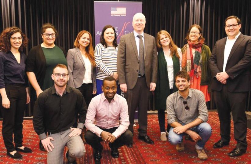 US ENVOY Jason Greenblatt (center) poses with Israeli students in Jerusalem after a meeting to discuss their views and perspectives on the future.  (photo credit: TWITTER)