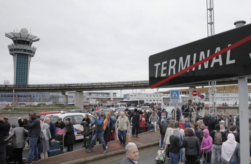 Passengers evacuated from Orly airport southern terminal after a shooting incident near Paris, France  (photo credit: REUTERS)