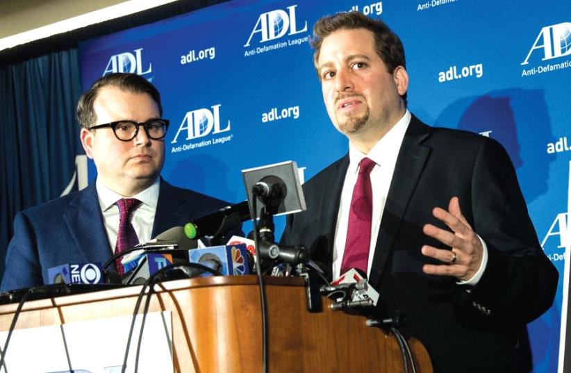 Oren Segal (right), director of the Anti- Defamation League’s Center on Extremism (photo credit: DREW ANGERER / AFP)