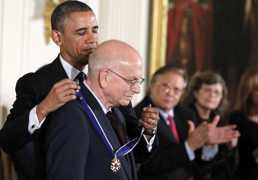 Former US president Barack Obama awards Daniel Kahneman the Presidential Medal of Freedom in 2013 at the White House. 