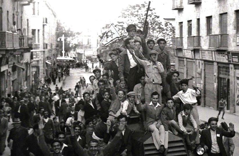 JEWS CELEBRATING the Partition Plan in 1947 in Jerusalem. ‘The UN General Assembly’s 1947 Partition Plan, which triggered the war, similarly injected pathological perspectives into our national identity,’ writes the author (photo credit: REUTERS)