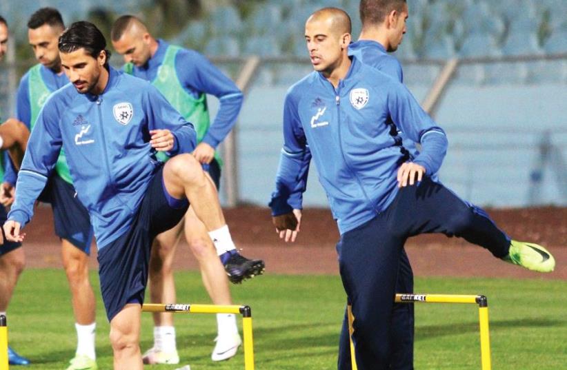 Lior Refaelov (left) is the favorite to be handed the final available attacking role for tonight’s 2018 World Cup qualifier in Spain, while forward Tal Ben-Haim (right) is all but guaranteed to be in the starting lineup for coach Elisha Levy’s team. (photo credit: ADI AVISHAI)