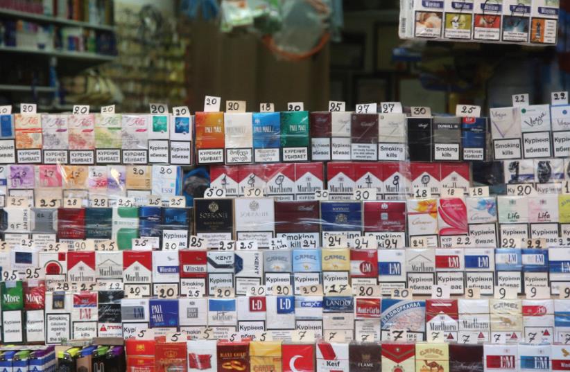 cigarettes displayed at the open market (photo credit: MARC ISRAEL SELLEM/THE JERUSALEM POST)