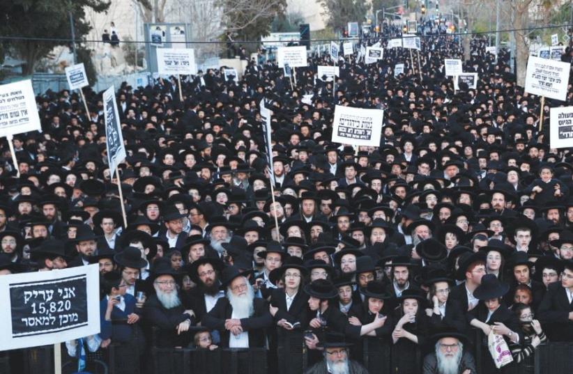 ULTRA-ORTHODOX protesters take part in a demonstration in Jerusalem last night against yeshiva students serving in the army. (photo credit: REUTERS)