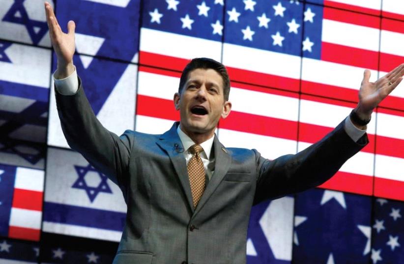 SPEAKER OF THE HOUSE Paul Ryan greets the crowd at Monday’s session of the AIPAC conference in Washington. (photo credit: REUTERS)