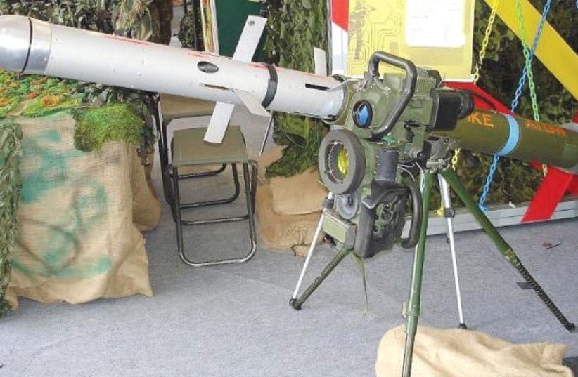 A SPIKE MISSILE is seen mounted on a tripod launcher at a Singapore Army Open House in 2007. (photo credit: Wikimedia Commons)