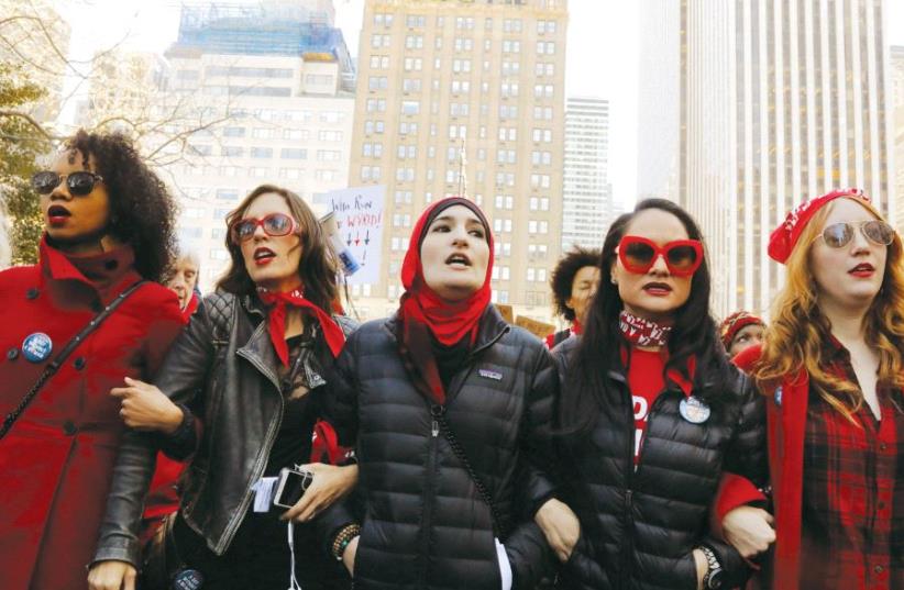 Linda Sarsour (center) leads during a ‘Day Without a Woman’ march on International Women’s Day in New York, earlier this month (photo credit: REUTERS)