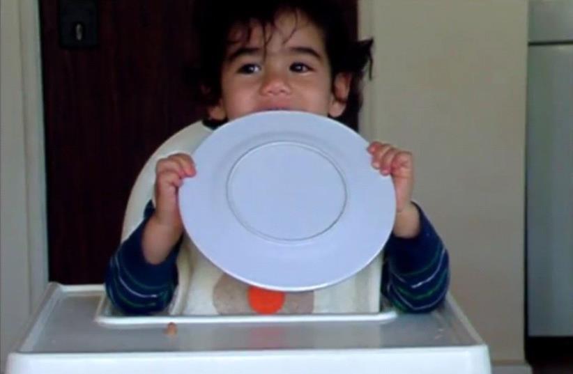 A baby tries gefilte fish for the first time. (photo credit: YOUTUBE)