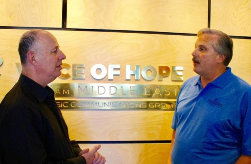 Communications Minister Tzachi Hanegbi meets with John Tayloe, founder and president of Strategic Communications Group, last week  (photo credit: VOICE OF HOPE)